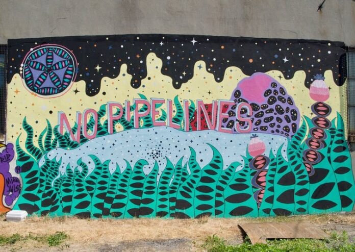 Street art can complement formal classroom learning. Here, ‘No more pipelines’ mural by the artist Swarm in Montréal. (Anna Augosto Rodrigues), Author provided